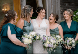 Bridal party action shot laughing