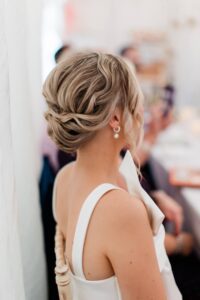 The textured bridal bun on blonde highlighted short hair